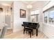 Sitting room with a piano and natural light from a nearby window at 601 Tradewind Ct., North Myrtle Beach, SC 29582