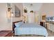 Bright bedroom with vaulted ceilings, ceiling fan, and decorative ledge for plants and artwork at 617 14Th Ave. S # 83, Surfside Beach, SC 29575