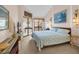 Cozy bedroom featuring a queen-sized bed, sliding glass doors to balcony, and light airy color scheme at 617 14Th Ave. S # 83, Surfside Beach, SC 29575