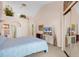 Light bedroom with vaulted ceilings, mirrored closet, and decorative ledge for plants and artwork at 617 14Th Ave. S # 83, Surfside Beach, SC 29575