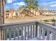 Townhouse community with well-maintained landscaping, sidewalks, and mature trees in the foreground at 617 14Th Ave. S # 83, Surfside Beach, SC 29575