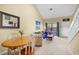 Relaxed living area with vaulted ceiling, sliding glass door to patio, comfortable seating, and dining space at 617 14Th Ave. S # 83, Surfside Beach, SC 29575
