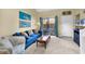 Cozy living room with comfortable seating, tasteful decor, and sliding glass doors that lead to a patio at 617 14Th Ave. S # 83, Surfside Beach, SC 29575
