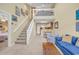 Inviting living room features a soaring ceiling, open floor plan, staircase, and abundant natural light at 617 14Th Ave. S # 83, Surfside Beach, SC 29575