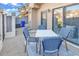 Cozy patio with stylish blue-and-white chairs, perfect for outdoor dining and relaxing at 617 14Th Ave. S # 83, Surfside Beach, SC 29575
