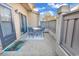 View of patio with table and chairs, privacy fence, and a 