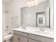 Bright bathroom featuring a double sink vanity with white countertops and a shower tub combo at 713 Lambeth Ln., Conway, SC 29526