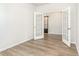 Bright room with wood-look flooring, neutral walls, and double glass doors; a cozy and versatile space at 713 Lambeth Ln., Conway, SC 29526