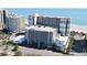Aerial view of the beachfront condo building highlighting the parking garage and location at 7200 Ocean Blvd. N # 1059, Myrtle Beach, SC 29572