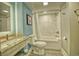 Clean bathroom featuring a marble vanity, tile floors, and a modern shower-tub combination at 7200 Ocean Blvd. N # 1059, Myrtle Beach, SC 29572