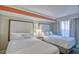 Bright bedroom featuring two beds with white linens and comfortable furnishings at 7200 Ocean Blvd. N # 1059, Myrtle Beach, SC 29572