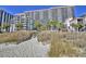 Beautiful oceanfront resort with multiple balconies accessible via sandy beach walkway and boardwalk at 7200 Ocean Blvd. N # 1059, Myrtle Beach, SC 29572