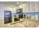 Stylish kitchen featuring granite countertops, modern appliances, and ample cabinet space at 7200 Ocean Blvd. N # 1059, Myrtle Beach, SC 29572