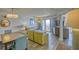 Open-concept living area with beachy décor, dining table, comfortable seating, and balcony access at 7200 Ocean Blvd. N # 1059, Myrtle Beach, SC 29572