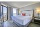 Relaxing main bedroom with balcony access offering picturesque views of the ocean at 7200 Ocean Blvd. N # 1059, Myrtle Beach, SC 29572