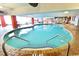 Indoor pool featuring tile accents and lounge chairs for relaxation at 7200 Ocean Blvd. N # 1059, Myrtle Beach, SC 29572