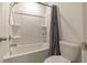 Bathroom featuring a tub and shower combination with tile surround and a grey shower curtain at 852 Harrison Mill St., Myrtle Beach, SC 29579