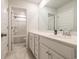 Bright bathroom featuring a vanity, and a view into a tub and shower combination at 852 Harrison Mill St., Myrtle Beach, SC 29579