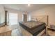Bedroom with a window providing natural light, carpet floors, and a large bed at 852 Harrison Mill St., Myrtle Beach, SC 29579