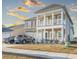 A two-story home with double porches shows great curb appeal on a sunny day at 852 Harrison Mill St., Myrtle Beach, SC 29579