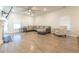 Bright living room featuring wood floors, a ceiling fan, and a comfortable sectional sofa at 852 Harrison Mill St., Myrtle Beach, SC 29579