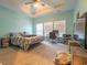 Spacious bedroom with tray ceilings, carpet, and multiple windows for natural light at 852 Harrison Mill St., Myrtle Beach, SC 29579