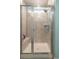 Walk-in shower with tiled walls, a built-in bench, and a glass enclosure at 852 Harrison Mill St., Myrtle Beach, SC 29579