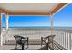 Outdoor seating allows you to take in the beach view from this unit's private balcony at 900 N Waccamaw Dr. # 301, Garden City Beach, SC 29576