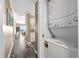 This hallway offers beach views and access to a stacked washer and dryer unit at 900 N Waccamaw Dr. # 301, Garden City Beach, SC 29576