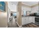 Efficient kitchen with white cabinets and stainless steel features at 900 N Waccamaw Dr. # 301, Garden City Beach, SC 29576
