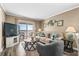 Relaxing living room with sofa, accent chair, and balcony access at 900 N Waccamaw Dr. # 301, Garden City Beach, SC 29576