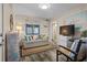Cozy living room featuring a sofa, chair, and coastal decor accents at 900 N Waccamaw Dr. # 301, Garden City Beach, SC 29576
