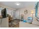 Comfortable living room with wood floors and access to outdoor entry at 900 N Waccamaw Dr. # 301, Garden City Beach, SC 29576