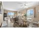 Bright living and dining area with ocean views and ceiling fan at 900 N Waccamaw Dr. # 301, Garden City Beach, SC 29576
