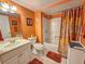 Bathroom featuring a single sink vanity, commode, and shower and tub combination at 9820 Queensway Blvd. # 1206, Myrtle Beach, SC 29572