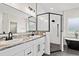 Modern main bathroom with a double vanity, granite counters, large mirror, and glass enclosed shower at 1052 Merritt Rd, Conway, SC 29526