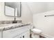 Well lit bathroom with granite countertop, modern faucet and hardware with a built-in toilet at 1052 Merritt Rd, Conway, SC 29526