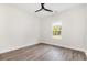 Bright bedroom featuring modern ceiling fan, natural light and stylish wood look flooring at 1052 Merritt Rd, Conway, SC 29526