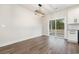 Open concept dining room with sliding glass doors to the backyard, a modern light fixture and wood floors at 1052 Merritt Rd, Conway, SC 29526