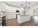 Modern kitchen with white cabinets, granite countertops, an island, and stainless steel appliances at 1052 Merritt Rd, Conway, SC 29526