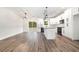 Modern kitchen with white cabinets, granite countertops, black appliances, and a large island at 1052 Merritt Rd, Conway, SC 29526