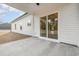 Covered back patio with sliding glass doors leading to the backyard and view of a lake at 1052 Merritt Rd, Conway, SC 29526