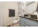 Bathroom featuring granite counters, wallpaper, and new fixtures at 115 Blue Pride Dr., Loris, SC 29569