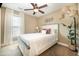 Bedroom featuring a ceiling fan, window, and a large floor lamp at 115 Blue Pride Dr., Loris, SC 29569