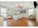 Spacious bedroom featuring hardwood floors, a ceiling fan, and a chair at 115 Blue Pride Dr., Loris, SC 29569