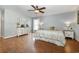 Bright bedroom featuring wood floors, a ceiling fan, and updated furniture at 115 Blue Pride Dr., Loris, SC 29569