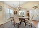 Traditional dining room with a wooden table, upholstered chairs, and elegant chandelier at 115 Blue Pride Dr., Loris, SC 29569