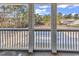 Covered balcony featuring a view of the surrounding landscape and pool below at 1230 St. George Ln. # F, Myrtle Beach, SC 29588