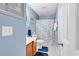 Bathroom with blue walls, vanity, toilet, and shower with decorative curtain at 1230 St. George Ln. # F, Myrtle Beach, SC 29588