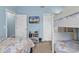 Bright bedroom with coastal decor, bunk beds, and a TV for entertainment at 1230 St. George Ln. # F, Myrtle Beach, SC 29588